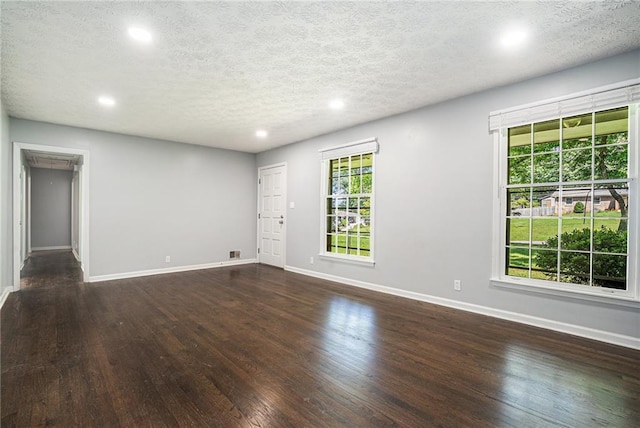 1663 Pounds Rd SW, Stone Mountain, GA 30087 - unfurnished room featuring recessed lighting, wood finished floors, baseboards, plenty of natural light, and a textured ceiling