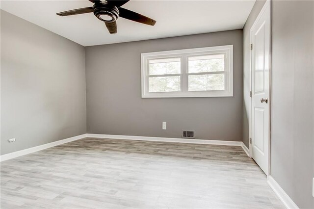 unfurnished living room with ornamental molding, sink, and light hardwood / wood-style floors