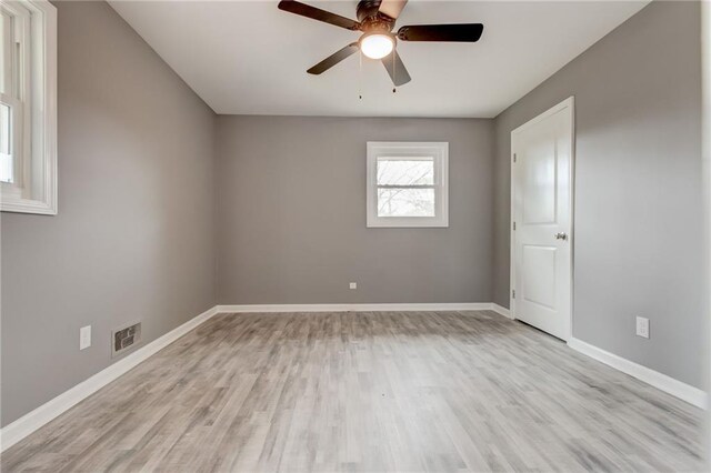 unfurnished room with light wood-type flooring