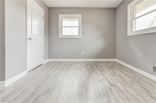 unfurnished bedroom with light wood-type flooring