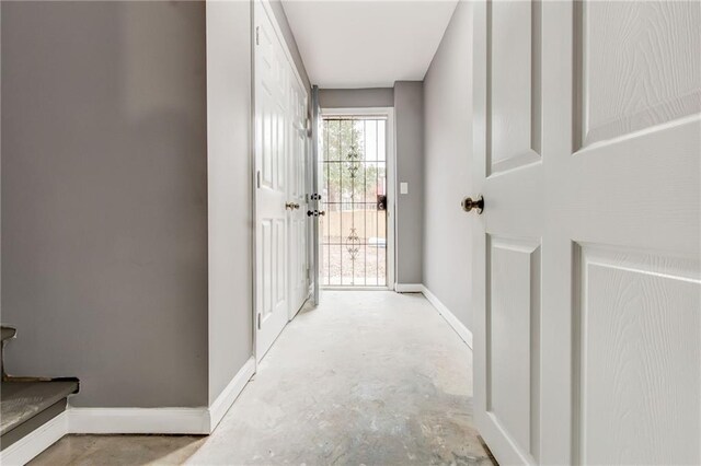 corridor featuring light tile patterned flooring