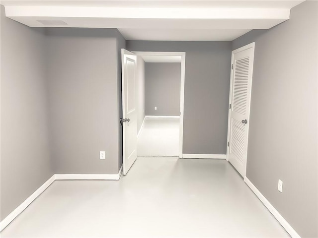 spare room featuring concrete flooring