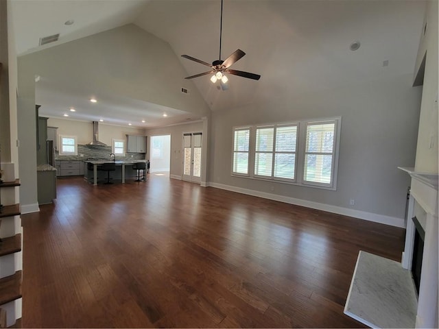 25 Mountain Crest Dr, Oxford, GA 30054 - unfurnished living room with visible vents, baseboards, dark wood-style flooring, a ceiling fan, and a fireplace with flush hearth