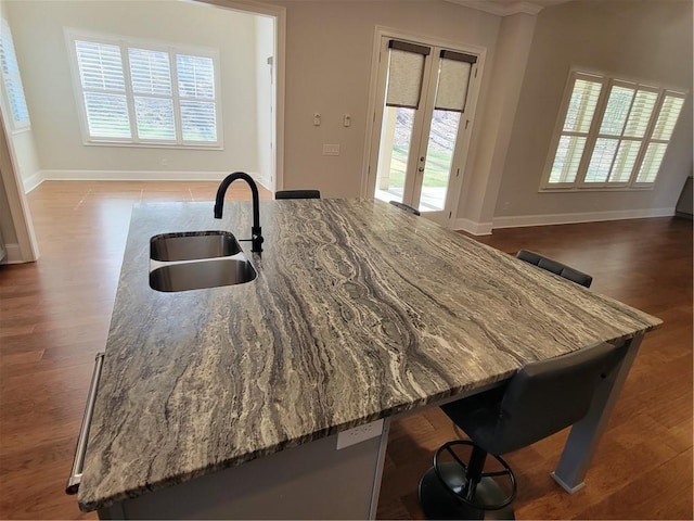 25 Mountain Crest Dr, Oxford, GA 30054 - kitchen with light stone countertops, open floor plan, baseboards, and a sink