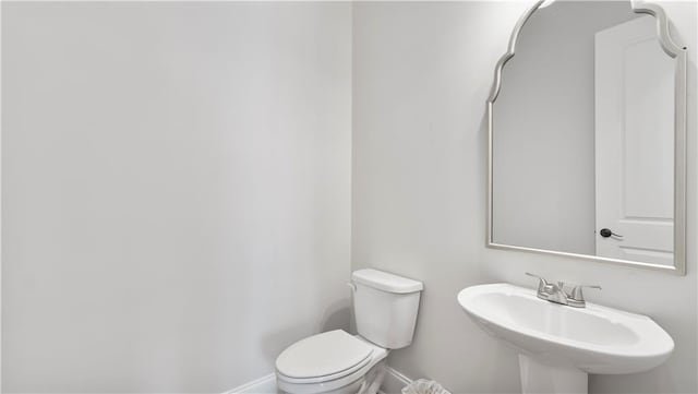 25 Mountain Crest Dr, Oxford, GA 30054 - half bathroom with a sink, toilet, and baseboards