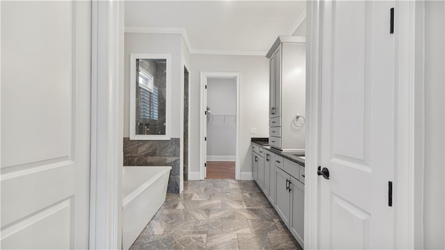 25 Mountain Crest Dr, Oxford, GA 30054 - full bathroom with a walk in closet, vanity, crown molding, and a washtub