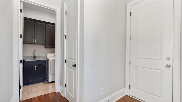25 Mountain Crest Dr, Oxford, GA 30054 - hallway featuring washer / clothes dryer, a sink, and baseboards