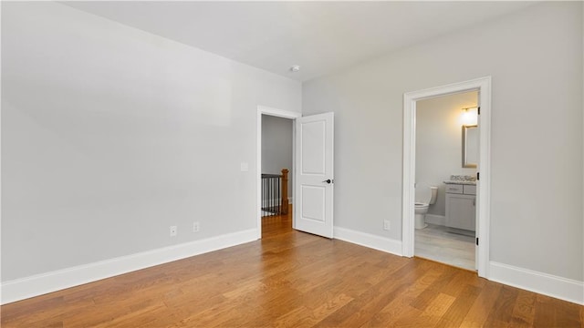 25 Mountain Crest Dr, Oxford, GA 30054 - unfurnished bedroom featuring baseboards, ensuite bath, and wood finished floors