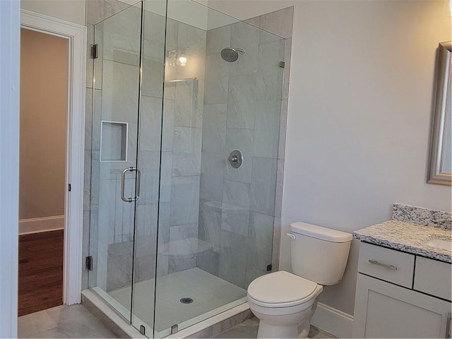 25 Mountain Crest Dr, Oxford, GA 30054 - bathroom with a shower stall, vanity, baseboards, and toilet