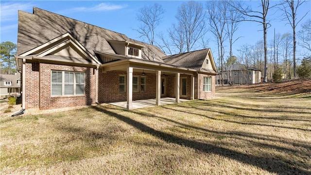 25 Mountain Crest Dr, Oxford, GA 30054 - rear view of house with a patio, brick siding, and a yard