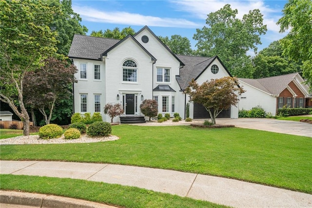 340 Chandler Ct, Sugar Hill, GA 30518 - view of front of home featuring concrete driveway, a front yard, and an attached garage