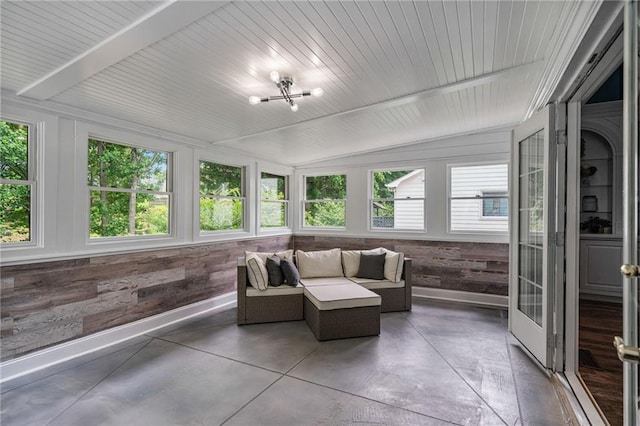 340 Chandler Ct, Sugar Hill, GA 30518 - sunroom / solarium with vaulted ceiling, plenty of natural light, concrete flooring, wooden walls, and baseboards