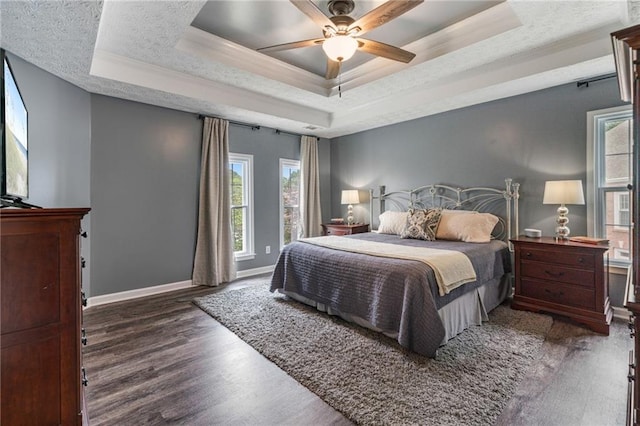 340 Chandler Ct, Sugar Hill, GA 30518 - bedroom featuring a raised ceiling, wood finished floors, baseboards, and crown molding