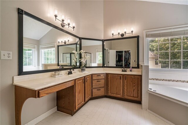 340 Chandler Ct, Sugar Hill, GA 30518 - full bathroom featuring lofted ceiling, double vanity, tile patterned floors, and a bath