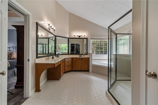 340 Chandler Ct, Sugar Hill, GA 30518 - ensuite bathroom featuring lofted ceiling, a bath, double vanity, a shower stall, and tile patterned floors