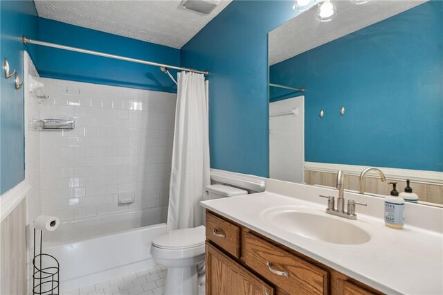 340 Chandler Ct, Sugar Hill, GA 30518 - full bath with shower / bath combo, toilet, vanity, a textured ceiling, and tile patterned floors