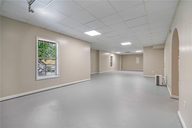 340 Chandler Ct, Sugar Hill, GA 30518 - spare room with concrete floors, arched walkways, a drop ceiling, and baseboards