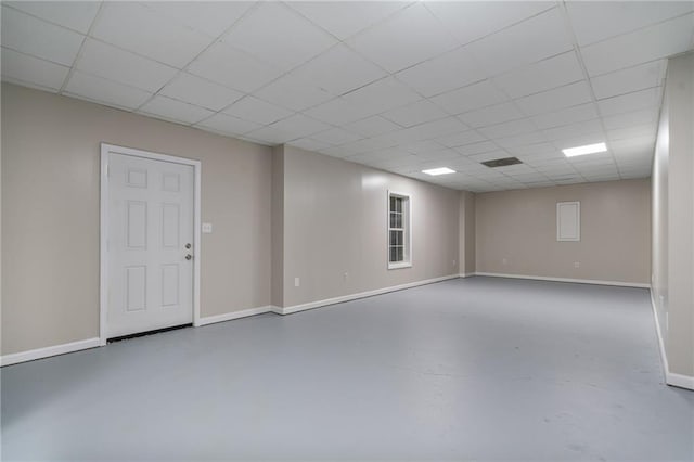 340 Chandler Ct, Sugar Hill, GA 30518 - empty room with finished concrete flooring, baseboards, and a paneled ceiling