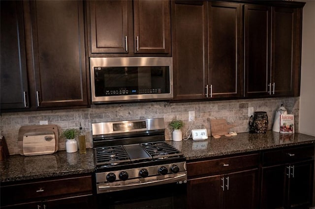 kitchen featuring dark stone countertops, tasteful backsplash, and stainless steel appliances