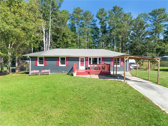 ranch-style home featuring a front yard and a carport