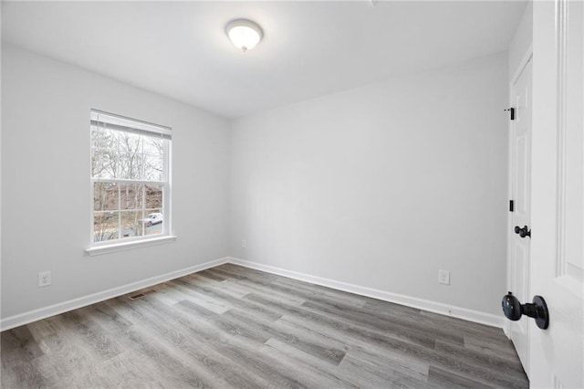 unfurnished room featuring light wood-type flooring