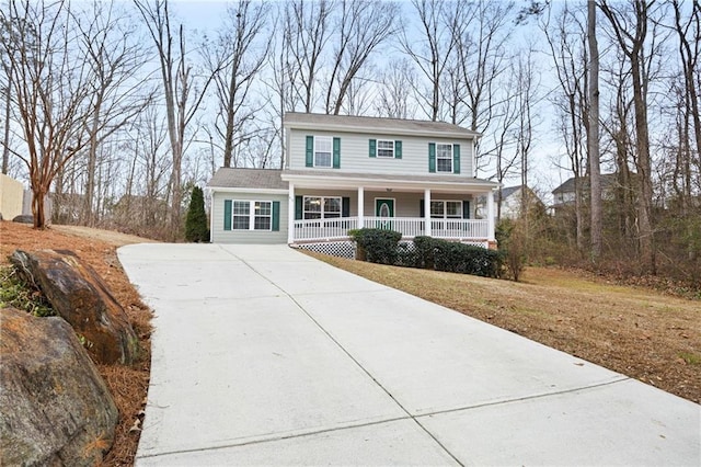 view of front of home featuring a front yard and a porch