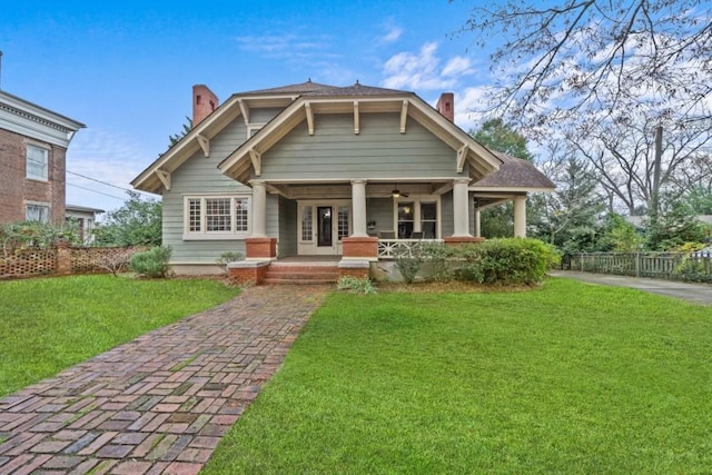 view of front of house featuring a porch and a front lawn