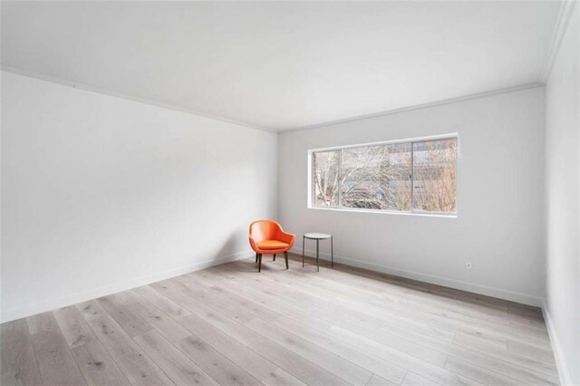 91 Rumson Rd Unit C 30, Atlanta, GA 30305 - empty room featuring crown molding, baseboards, and wood finished floors