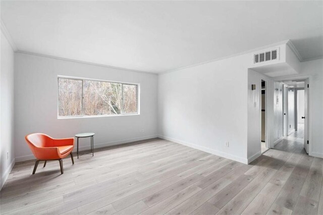 91 Rumson Rd Unit C 30, Atlanta, GA 30305 - living area featuring crown molding, wood finished floors, and baseboards