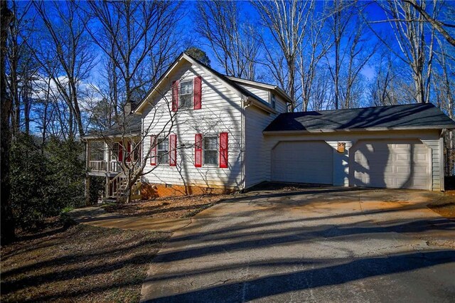 view of side of home with a garage