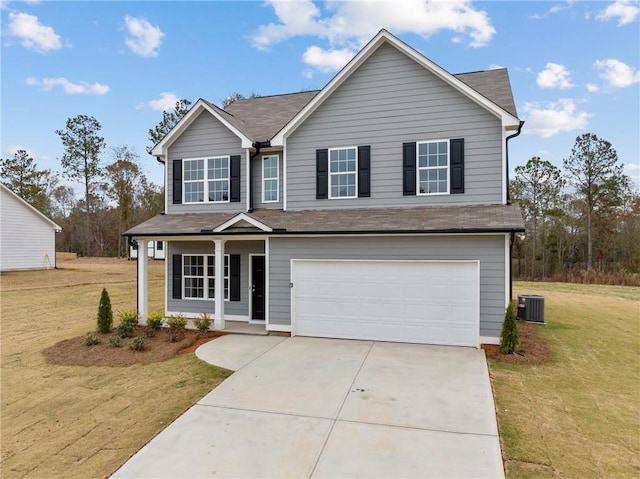 traditional home with central air condition unit, a porch, a front yard, a garage, and driveway