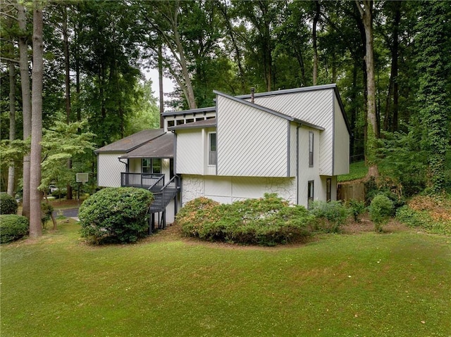 rear view of property with a yard