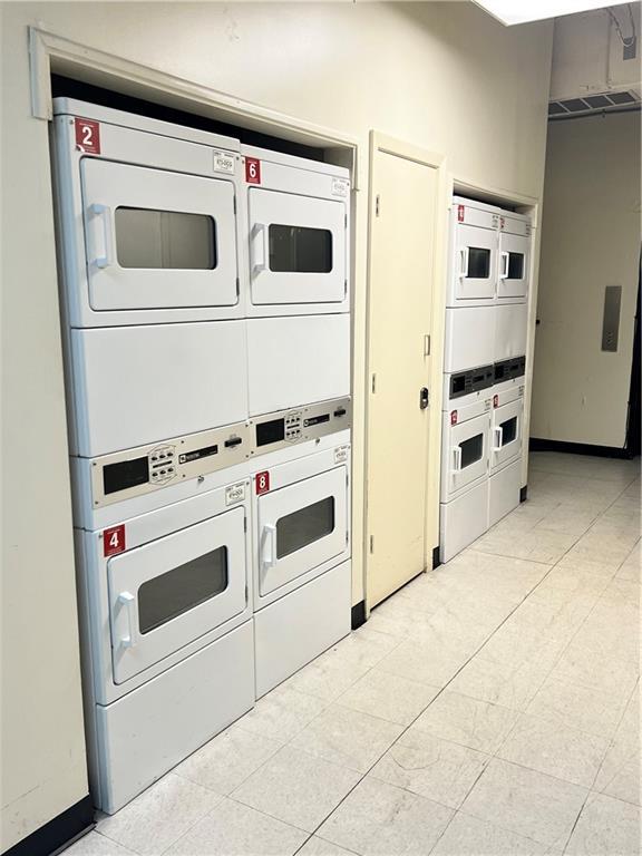 kitchen with stacked washer and dryer