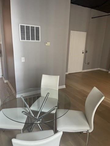 dining room with hardwood / wood-style floors