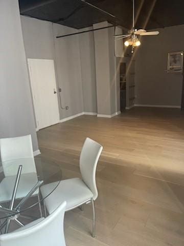 unfurnished dining area featuring hardwood / wood-style floors and ceiling fan