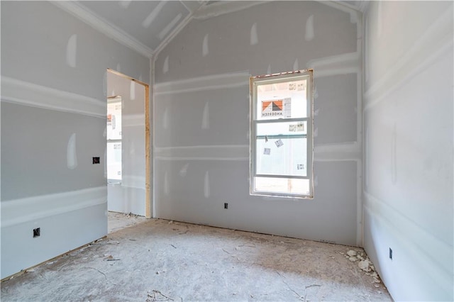 unfurnished room featuring lofted ceiling