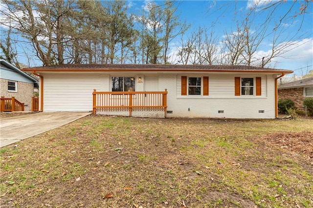 ranch-style home with a wooden deck and a front lawn