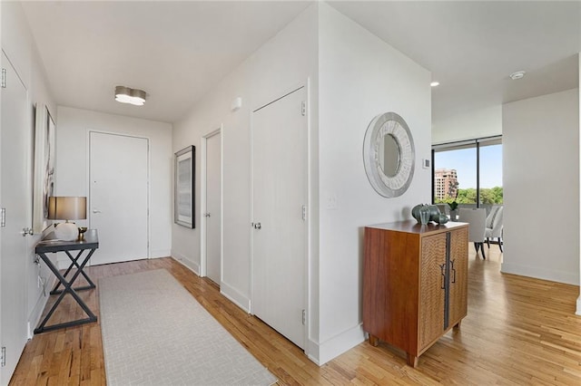 corridor featuring light hardwood / wood-style flooring