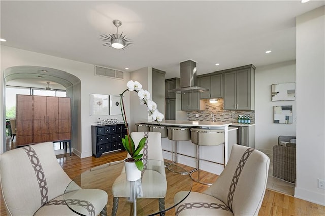 dining space with light hardwood / wood-style floors