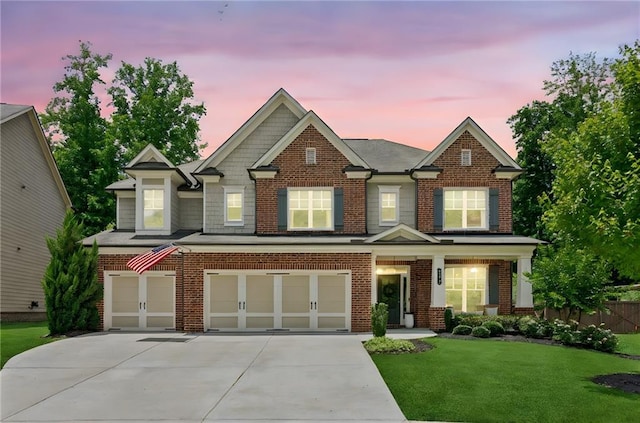 4972 Park Vale Dr, Sugar Hill, GA 30518 - view of front facade featuring an attached garage, concrete driveway, and brick siding