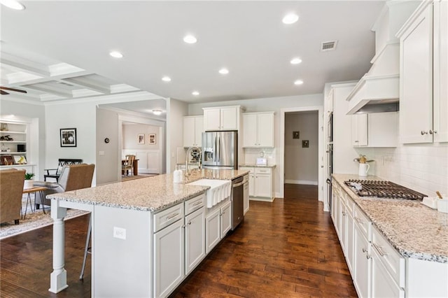 4972 Park Vale Dr, Sugar Hill, GA 30518 - kitchen featuring appliances with stainless steel finishes, tasteful backsplash, beamed ceiling, premium range hood, and recessed lighting
