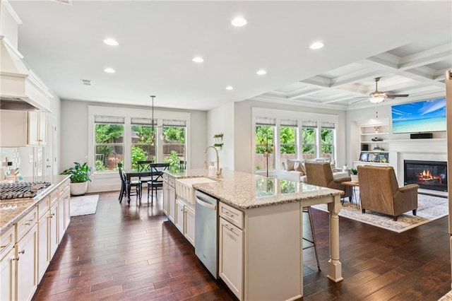 4972 Park Vale Dr, Sugar Hill, GA 30518 - kitchen featuring appliances with stainless steel finishes, recessed lighting, a kitchen bar, plenty of natural light, and dark wood-style flooring