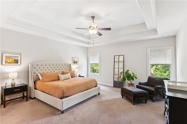 4972 Park Vale Dr, Sugar Hill, GA 30518 - carpeted bedroom featuring a tray ceiling, multiple windows, and a ceiling fan