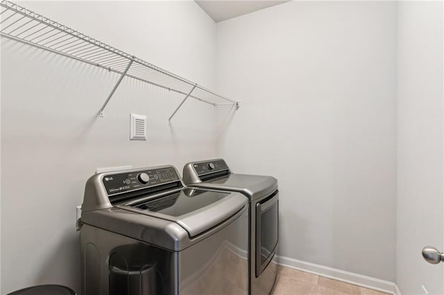 4972 Park Vale Dr, Sugar Hill, GA 30518 - laundry room featuring washing machine and clothes dryer and light tile patterned floors