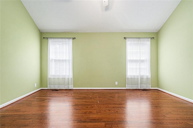 6411 Compass Dr, Flowery Branch, GA 30542 - empty room with plenty of natural light and wood finished floors