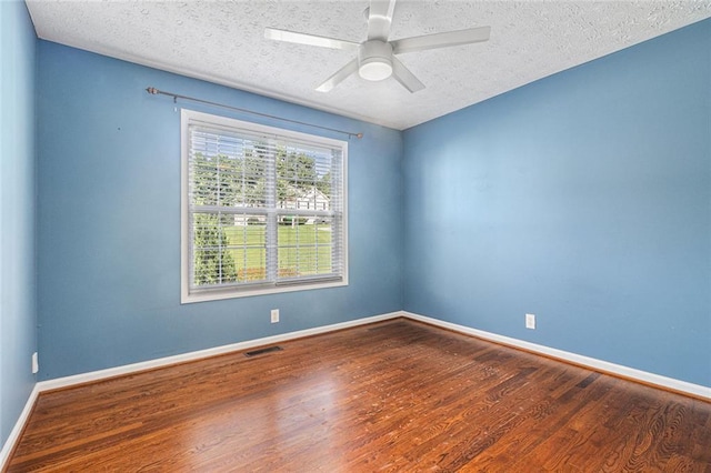 6411 Compass Dr, Flowery Branch, GA 30542 - unfurnished room with wood finished floors, a textured ceiling, and a ceiling fan