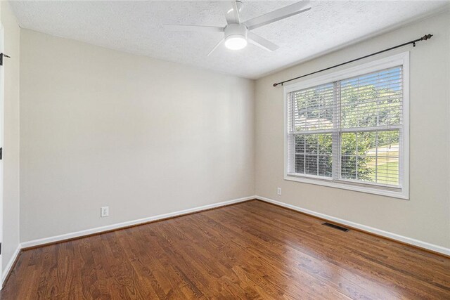 6411 Compass Dr, Flowery Branch, GA 30542 - unfurnished room with wood finished floors, a textured ceiling, and ceiling fan