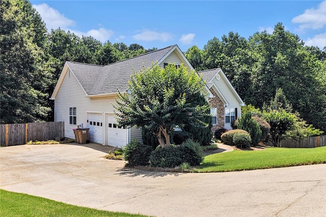 6411 Compass Dr, Flowery Branch, GA 30542 - view of side of property featuring concrete driveway, a garage, and a shingled roof