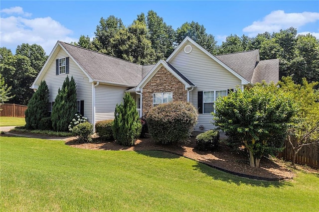6411 Compass Dr, Flowery Branch, GA 30542 - view of front facade featuring stone siding and roof with shingles