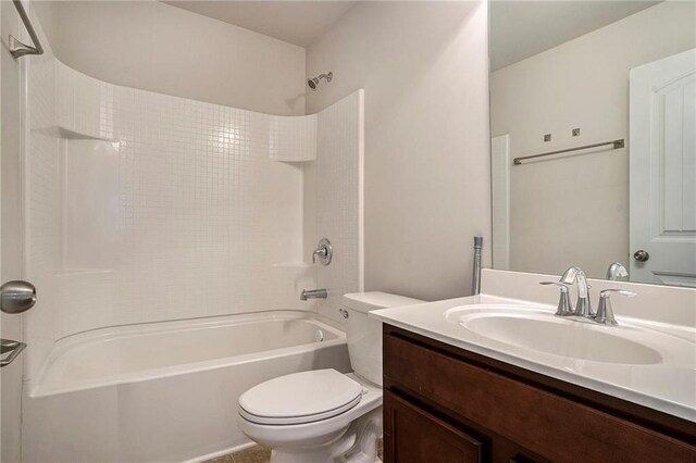 full bathroom with washtub / shower combination, vanity, and toilet